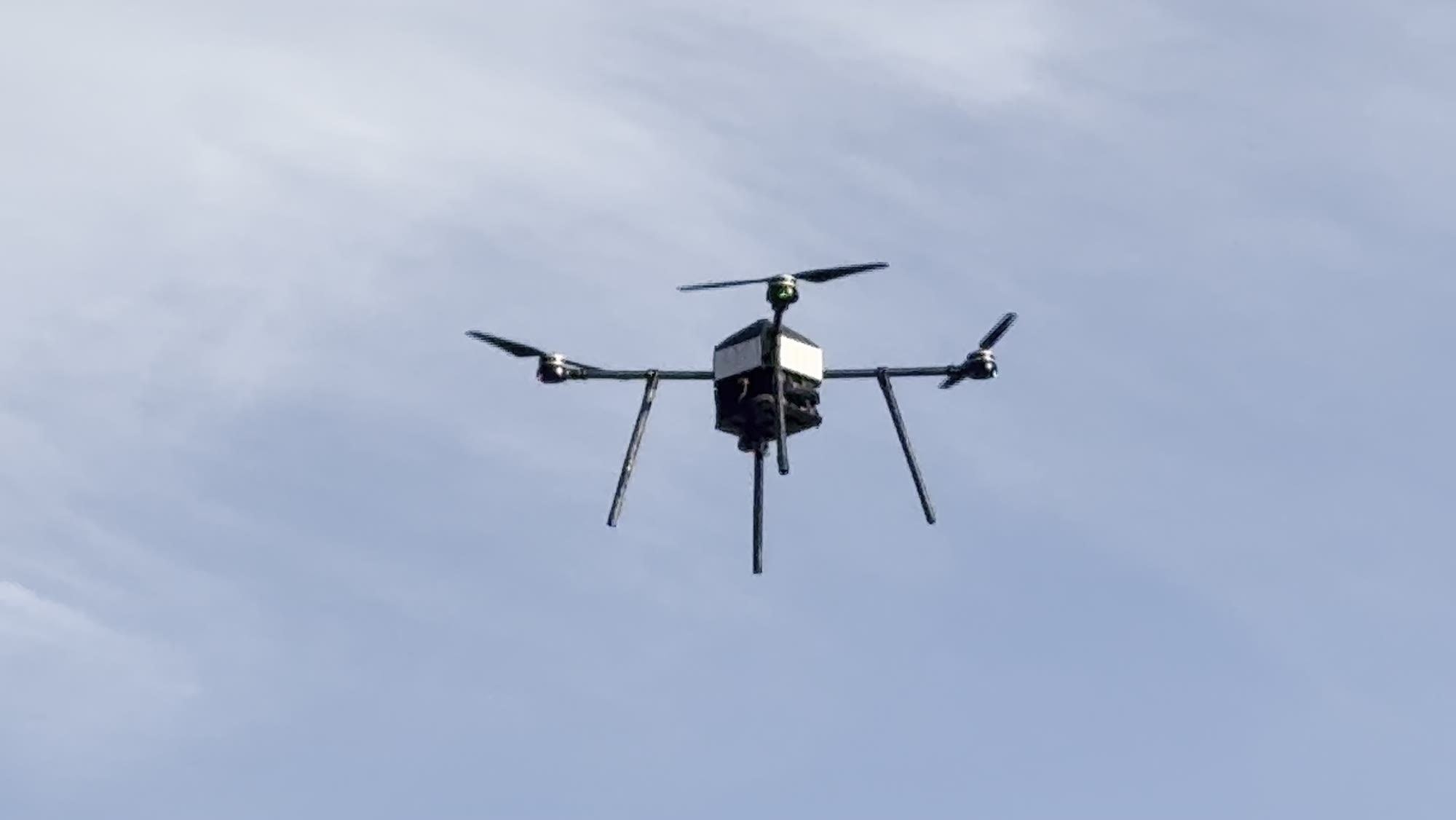 Falx uncrewed aerial system banking during a flight test, seen from below
